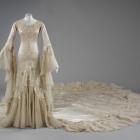 Notable British designer Norman Hartnell designed  this magnificent silk satin and tulle gown...