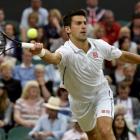 Novak Djokovic hits a return to Jo-Wilfried Tsonga. REUTERS/Toby Melville