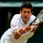 Novak Djokovic of Serbia hits a return to Jeremy Chardy of France in their men's singles match at...
