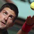Novak Djokovic of Serbia serves in his match against Victor Hanescu of Romania during the second...