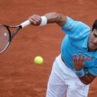 Novak Djokovic serves to Joao Sousa. REUTERS/Gonzalo Fuentes