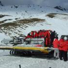 NZSki staff prepare to board a snow-groomer  to  help in the grid search on Thursday. Photo by...