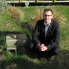 Oamaru Blue Penguin Colony manager Jason Gaskill checks  blue penguin nesting boxes. Photo by...