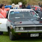 Oamaru couple Barry and Jane Sinclair, with pet Maltese Meg, display their '72 Dodge at the Great...