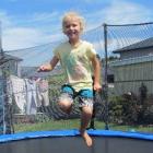 Oamaru girl Emjai Welsh jumps on her trampoline, having removed the external sound receiver for...