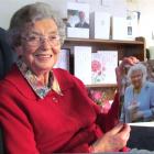 Oamaru's Bina Mulligan, who turns 100 tomorrow, with her birthday card from the Queen, and others...
