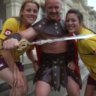 Oamaru Titans Top Town mascot and captain Darrin Low and team-mates Janelle Casey (left) and...