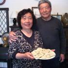 Of all the New Year foods, Ji Ying Xue (left) and Qi Rong Xie say dumplings are the most...