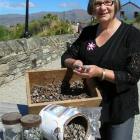 Old Cromwell Inc manager Elisabeth Williamson is delighted at the hundreds of lead-head nails...
