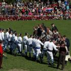 Players from Nelson College (in white) shake hands with players from Nelson Rugby Club before...