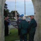 Opening the arch . . . Members of the Rotary Club of Waitaki (from left) Paul Mortimer, Mel Kington, Robbie Julius, Bob Sutherland and Ross Mitchell remove the gates from the Garden of Memories in Oamaru on Wednesday night to have them repaired, sand-blas