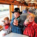 On board the train before departure are (from left) Anna Telfer Chiles (5), Josh Telfer Chiles (8...