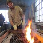 On fire . . . Blacksmith Nate Savill  works in the Dunedin Gasworks  Museum Forge. Photo by...