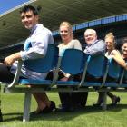 On salvaged Carisbrook seats at North Harbour Stadium are (from left) stadium event co-ordinators...