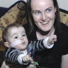 Only a feeding tube gives away the fact the health of Dunedin toddler Reuben Jones (1), with his...