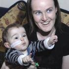 Only a feeding tube gives away the fact the health of Dunedin toddler Reuben Jones (1), with his...