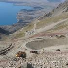 A reservoir and trenches for pipes have been excavated on Ohau Snowfields (with Lake Ohau in the...