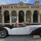 Ophir postmistress Val Butcher sits in the lap of luxury, a 1934 Bugatti Gangloff Roadster ''Type...