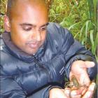 Orokonui Ecosanctuary aquatic biologist Noel Jhinku gets up close and personal with a koura, a...
