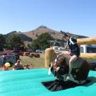 Oscar Engelbrecht (12), of Stoneburn, rides the mechanical bull at the show. Photo by Bill Campbell.