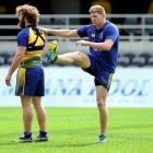 Otago All Black Adam Thomson leans on prop Liam Coltman at the captain's run at Forsyth Barr...