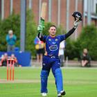 Otago batsman Brendon McCullum celebrates his century against Auckland in the HRV Cup twenty/20...