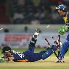 Otago batsman Brendon McCullum dives for the crease as Cape Cobras wicketkeeper Ryan Canning...