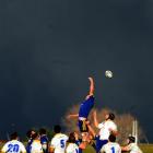 Otago Blue lock Tom Donnelly jumps in the line-out against a very dark sky during the Otago trial...