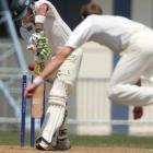 Otago bowler James McMillan skittles Central Districts batsman Tim Weston at Napier yesterday....
