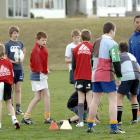 Otago captain Alando Soakai trains the Kaikorai Black Under-13 team at Bishopscourt last night....