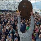 Otago captain Paul Grant raises the Ranfurly Shield to the delight of thousands of fans at...