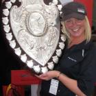 Otago Daily Times Queenstown bureau chief Tracey Roxburgh holds the Ranfurly Shield yesterday....