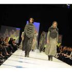 Ali McD models Sarah Johnston and Eva Duncan parade Igor Galas' knitted works at the Emerging...