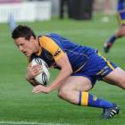 Otago first five-eighth Glen Dickson scores a try for Otago against Manawatu in their ITM Cup...