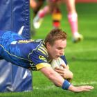 Otago first five Hayden Parker dives over to score against Waikato. Photo by Peter McIntosh