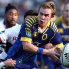 Otago first five Hayden Parker looks to bust through the North Harbour defence. (Photo by Rob...