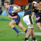 Otago first five Hayden Parker sets off upfield against Wellington during their ITM Cup match at...