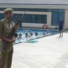 Otago fitness trainer Chris Donaldson leads the Volts in a fitness session while an armed...