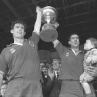 Otago forwards Mike Brewer (left) and Richard Knight celebrate with the trophy after sealing...