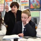 Otago Girls' High School mathematics teacher Jeanette Chapman helps pupils (from left) Emma...