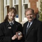 Otago Girls High School pupil Anna Scadden with the Waterford Crystal clock presented by honorary...