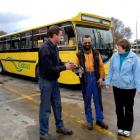 Otago Heritage Bus Society member Alastair Stewart (left), Citibus mechanic Mike Jeffery and...