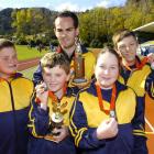 Otago Independence Games gold medallists celebrating at the Caledonian Ground yesterday are (from...