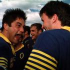 Otago loose forward Taine Randell yells with delight at team-mate John Leslie after the 1998...