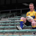 Otago midfielder Sam Giddens relaxes after team training at the Queenstown Events Centre...