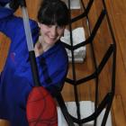 Otago Museum design services co-ordinator Rebecca McMaster takes a closer look at a glass paddle...