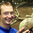 Otago Museum property services co-ordinator Joel Oldridge with the returned dinosaur egg fossil....