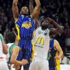 Otago Nuggets forward John Barber jun looks for the shot above Manawatu Jets defender Richard...