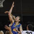 Otago Nuggets import Tyler Amaya goes up to the basket in front of Hawkes Bay defender Jon Rogers...