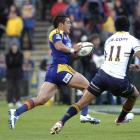 Otago number 10 Daniel Bowden runs to score a try against the Brumbies at Carisbrook tonight....